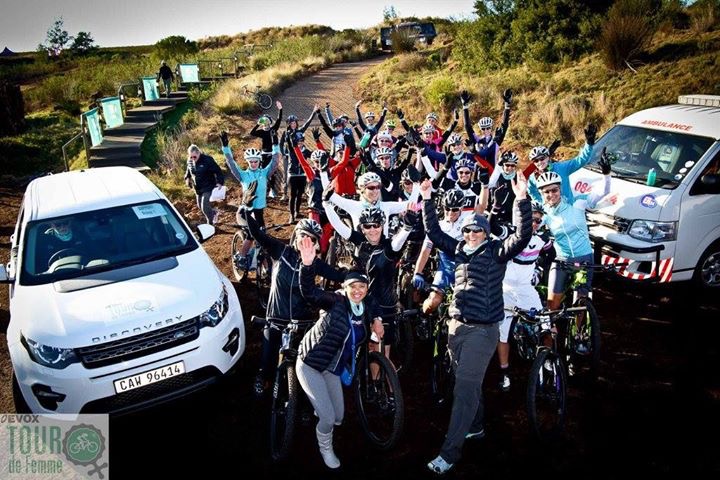 Riders celebrating with the Tour de Femme support vehicles in South Africa